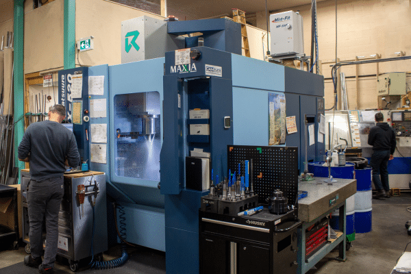 A modern CNC machining center in operation at Rainhouse Manufacturing, showcasing advanced equipment, precision machining, and a clean, efficient shop environment.