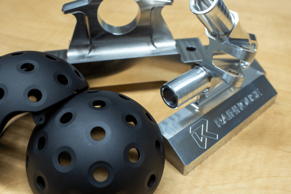 Precision machined aluminum component showing detailed CNC machined materials and surface finish quality produced by Rainhouse Manufacturing Canada Ltd.